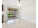 Dining room with tile floors and a sliding glass door that leads to a patio at 5763 Saint Christopher Dr # 55, Orlando, FL 32822