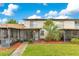 Charming townhome features a screened porch, front yard, and well-maintained landscaping at 5763 Saint Christopher Dr # 55, Orlando, FL 32822
