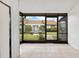 Enclosed lanai with tile flooring and view of a landscaped lawn and community buildings at 5763 Saint Christopher Dr # 55, Orlando, FL 32822