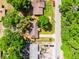 Aerial view of a home with mature trees and a long driveway at 5831 Nw 58Th Ter, Ocala, FL 34482