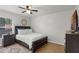 Comfortable bedroom with a queen-sized bed, wood flooring, and natural light at 5831 Nw 58Th Ter, Ocala, FL 34482