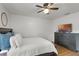 Bedroom with a TV on the dresser and a large window at 5831 Nw 58Th Ter, Ocala, FL 34482