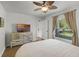 Bedroom with a ceiling fan, TV, and a dresser at 5831 Nw 58Th Ter, Ocala, FL 34482
