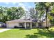 Charming single-story home features a well-manicured lawn and attached garage at 5831 Nw 58Th Ter, Ocala, FL 34482
