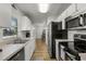 Bright kitchen with stainless steel appliances and white cabinetry at 5831 Nw 58Th Ter, Ocala, FL 34482
