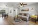 Cozy living room with wood floors, a comfortable sectional sofa, and contemporary decor at 5831 Nw 58Th Ter, Ocala, FL 34482