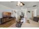 Stylish living room with laminate flooring, comfortable seating, and open concept design at 5831 Nw 58Th Ter, Ocala, FL 34482