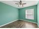 The bedroom features new flooring, fresh paint, and a ceiling fan at 610 Cranes Way # 207, Altamonte Springs, FL 32701