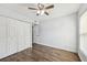 Bedroom features new flooring, a ceiling fan, and a large closet at 610 Cranes Way # 207, Altamonte Springs, FL 32701