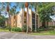 Attractive condo complex with lush landscaping and mature palm trees offering serene Florida living at 610 Cranes Way # 207, Altamonte Springs, FL 32701