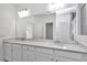 Bathroom featuring double vanity with quartz countertop and ample storage at 7563 Sw 78Th Ter, Ocala, FL 34481
