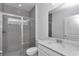 Bathroom features gray tile shower with glass door, quartz counters, and single sink at 7563 Sw 78Th Ter, Ocala, FL 34481