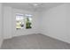Bedroom with carpet, fan, and window providing natural light and view at 7563 Sw 78Th Ter, Ocala, FL 34481
