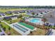 Aerial view of community amenities including pool, tennis court and shuffleboard, perfect for an active lifestyle at 7563 Sw 78Th Ter, Ocala, FL 34481