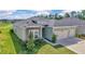 Charming one-story home featuring stone accents, manicured landscaping, and a two-car attached garage at 7563 Sw 78Th Ter, Ocala, FL 34481