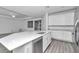 Modern kitchen featuring a large center island with stainless steel appliances and white cabinetry at 7563 Sw 78Th Ter, Ocala, FL 34481