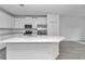 Open kitchen featuring a large island, stainless steel appliances, and ample cabinet space at 7563 Sw 78Th Ter, Ocala, FL 34481