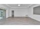 Bright living area featuring wood-look floors, large windows, and modern neutral walls at 7563 Sw 78Th Ter, Ocala, FL 34481
