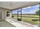 Screened-in patio with ceiling fan overlooking backyard at 7563 Sw 78Th Ter, Ocala, FL 34481