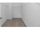 Walk-in closet features carpet floors and multiple white metal shelves for storage at 7563 Sw 78Th Ter, Ocala, FL 34481