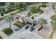Aerial view of the community entrance featuring lush landscaping and a secure entry point at 7651 Whisper Way # 104, Reunion, FL 34747