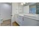 Stylish bathroom with double vanity, modern fixtures, and ample storage space, offering both functionality and elegance at 7651 Whisper Way # 104, Reunion, FL 34747