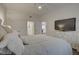 Bright bedroom featuring a comfortable bed, and neutral decor, offering a peaceful retreat within the home at 7651 Whisper Way # 104, Reunion, FL 34747