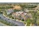 Beautiful condominium with multi-level balconies, surrounded by lush landscaping and palm trees at 7651 Whisper Way # 104, Reunion, FL 34747