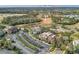 Elevated view showcasing condominiums near a water park with palm trees and parking at 7651 Whisper Way # 104, Reunion, FL 34747
