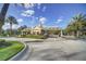 Grand entrance to the Reunion community featuring manicured landscaping and a charming guardhouse at 7651 Whisper Way # 104, Reunion, FL 34747