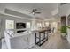 Spacious home with an open living space, dining area, and modern kitchen, perfect for entertaining at 7651 Whisper Way # 104, Reunion, FL 34747