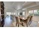 Open-concept living space with a dining area, living room, and sliding glass doors for natural light at 7651 Whisper Way # 104, Reunion, FL 34747