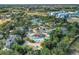 Expansive water park featuring pools, slides, and palm trees at 7651 Whisper Way # 104, Reunion, FL 34747