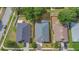 Aerial view highlighting backyard, landscaping, privacy fence, neighboring homes at 7718 Cafaro Dr, Orlando, FL 32818