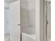 Bright bathroom featuring a large soaking tub and a glass-enclosed shower stall at 7718 Cafaro Dr, Orlando, FL 32818