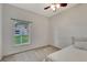 Bedroom with a window, carpet, and ceiling fan at 7718 Cafaro Dr, Orlando, FL 32818