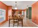 Bright dining area featuring tiled floors, and an archway to the open concept kitchen at 7718 Cafaro Dr, Orlando, FL 32818