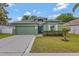 Charming single-Gathering home with a two-car garage, inviting entrance, and well-kept lawn at 7718 Cafaro Dr, Orlando, FL 32818