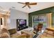 Relaxing living room featuring tile floors, a ceiling fan and comfortable seating at 7718 Cafaro Dr, Orlando, FL 32818