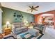 Comfortable living room open to the kitchen featuring stylish furniture, fan, and neutral tones at 7718 Cafaro Dr, Orlando, FL 32818