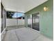 Relaxing screened-in patio with an outdoor light and views to the private backyard at 7718 Cafaro Dr, Orlando, FL 32818