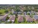 Aerial view of a residential street, highlighting the neat lawns and diverse architecture of the neighboring homes at 7718 Cafaro Dr, Orlando, FL 32818
