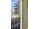 Bright view from window overlooking a serene street and neighboring homes at 7718 Cafaro Dr, Orlando, FL 32818