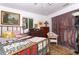 Comfortable bedroom with wooden floors, and neutral walls at 7761 Hillcrest Ter, Orlando, FL 32810