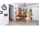 Cozy dining area featuring modern furniture and ample natural light at 7761 Hillcrest Ter, Orlando, FL 32810