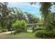 Home exterior with lush landscaping, inviting curb appeal, and a tranquil setting at 7761 Hillcrest Ter, Orlando, FL 32810