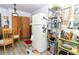 Eat-in kitchen with lots of natural light, laminate flooring, and white appliances at 7761 Hillcrest Ter, Orlando, FL 32810