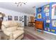 Vibrant living area with bright accent wall, stylish decor, and comfortable seating at 7761 Hillcrest Ter, Orlando, FL 32810