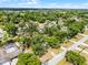Overhead view of neighborhood homes surrounded by mature trees, showcasing community and environment at 7807 Napoleon St, Orlando, FL 32825