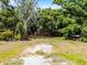 Lush backyard with mature trees provides a serene, private outdoor living space at 7807 Napoleon St, Orlando, FL 32825